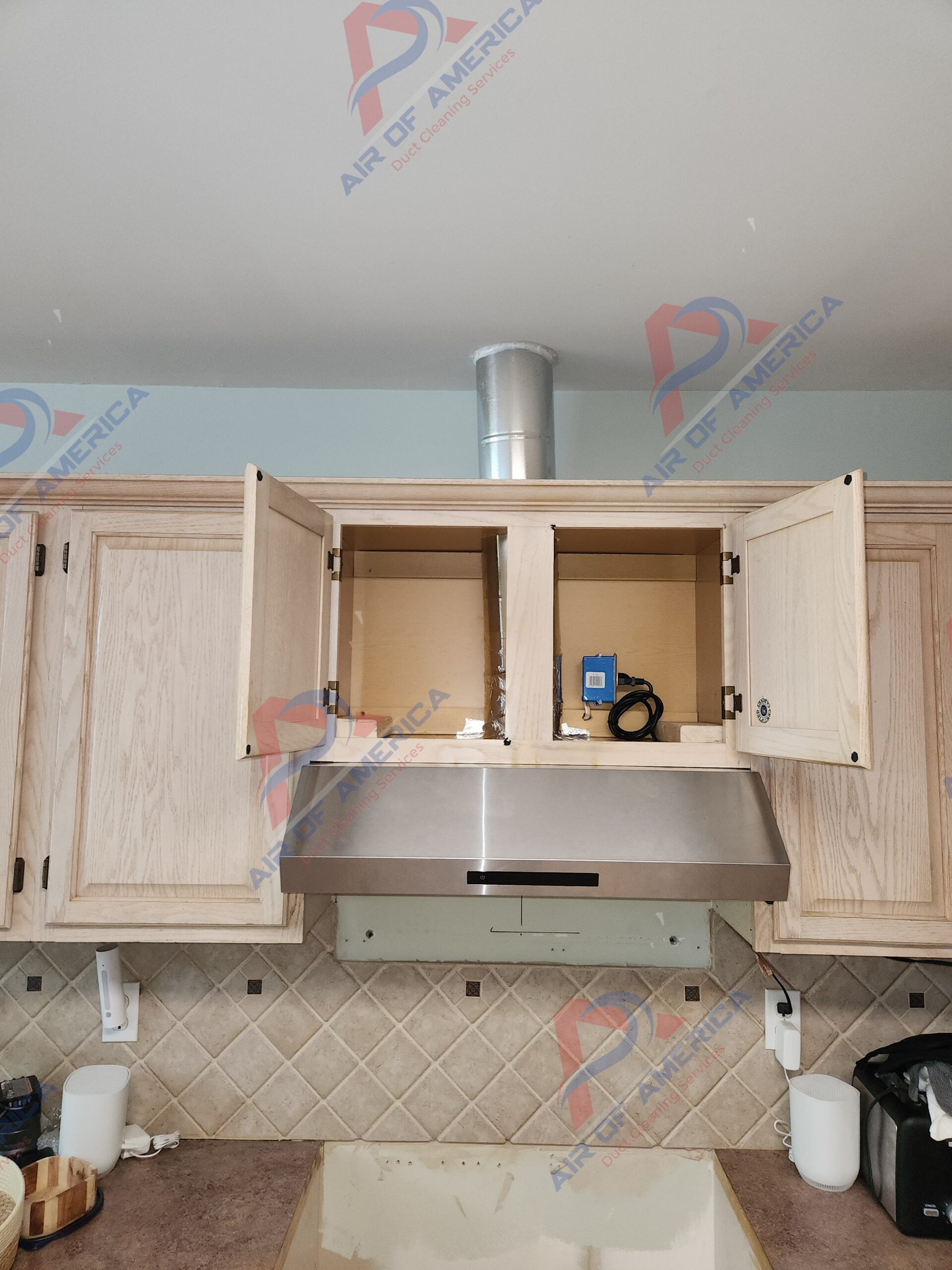 Kitchen hood vent installation Metro Atlanta — range hood connection through cabinet